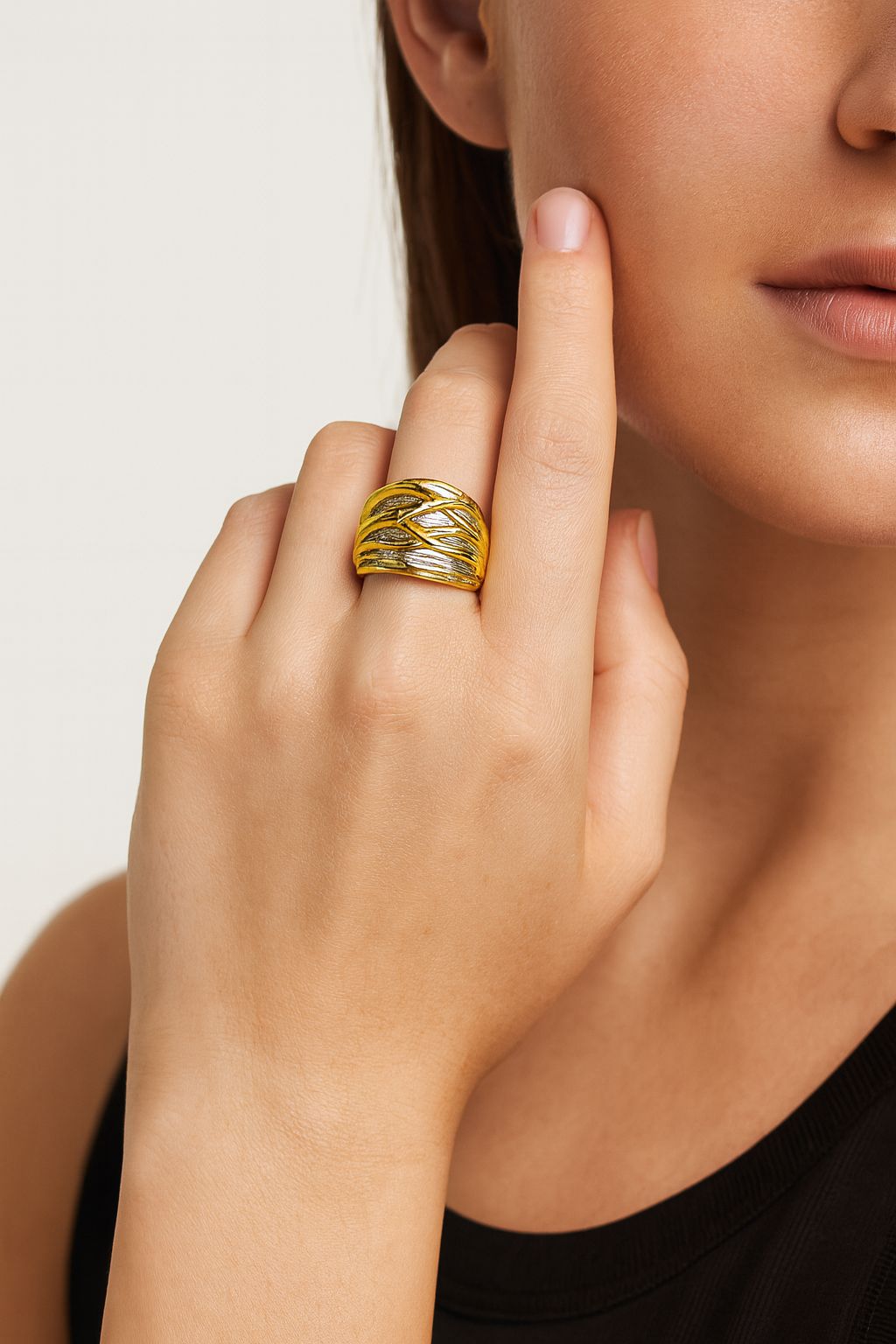 Woman wearing wide KC gold statement band ring