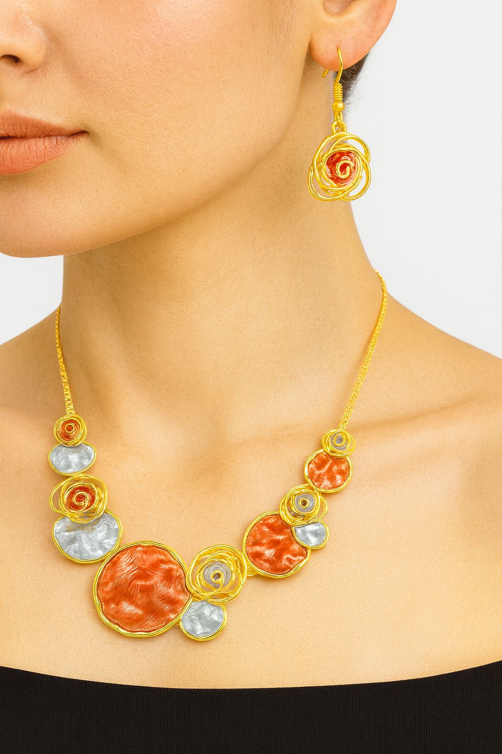 Closeup of hand-painted textured metal pendant necklace