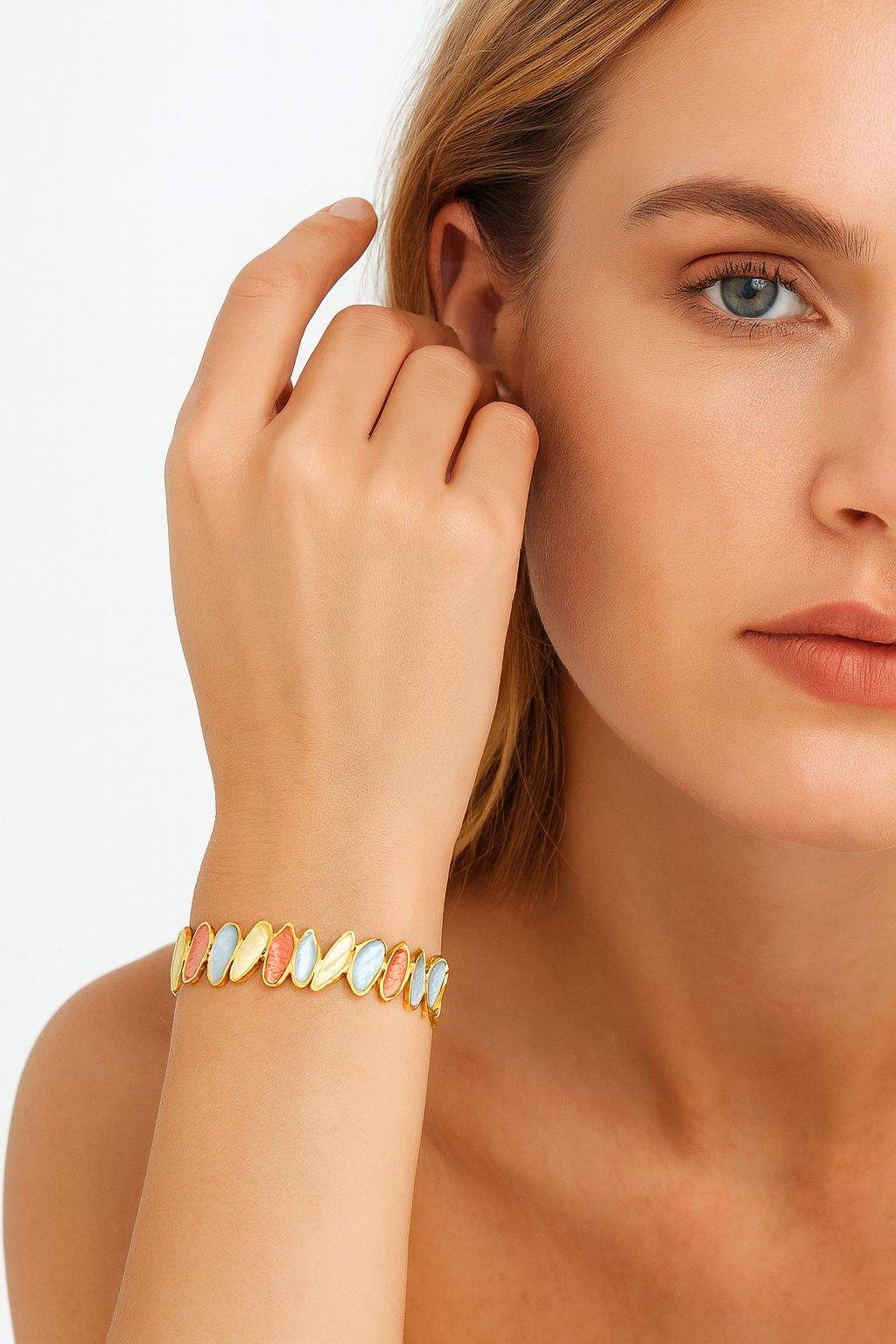 KC gold alloy bracelet worn on wrist