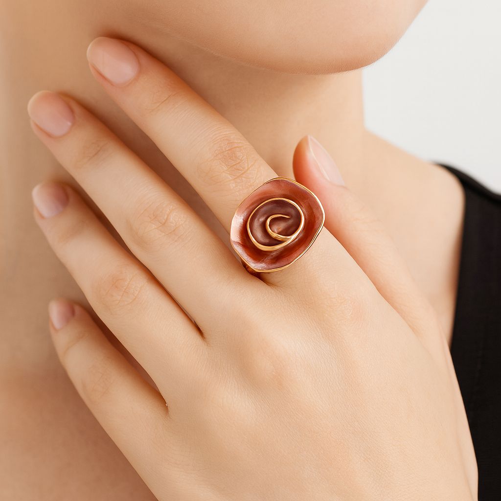 Close-up of KC gold plated enamel flower ring with artistic design