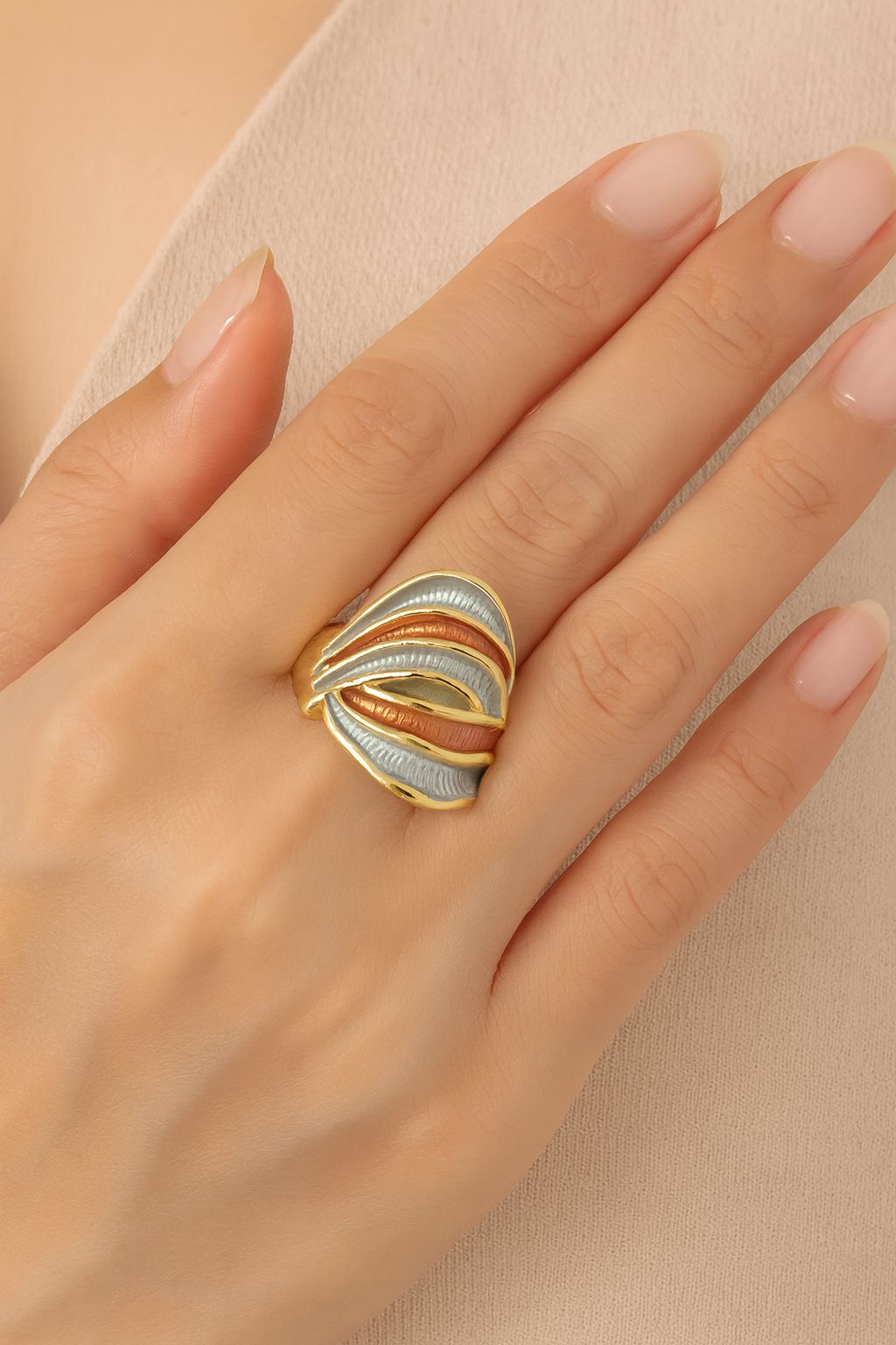 Hand-painted alloy KC gold ring showcased on female model