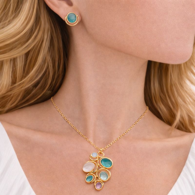 Close up of KC gold plated hand painted enamel necklace pendant