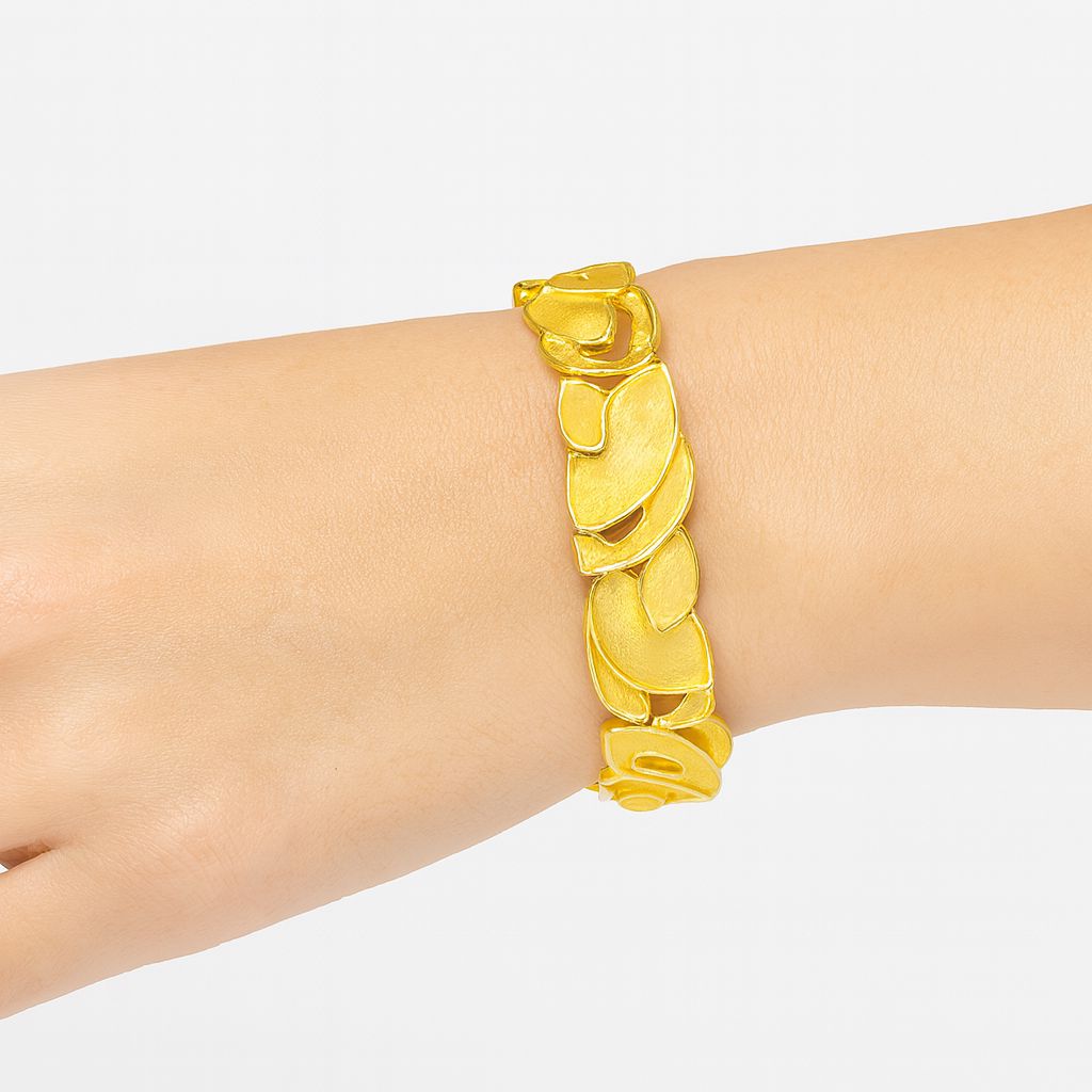  Woman wearing hand-painted KC gold bracelet with elegant outfit