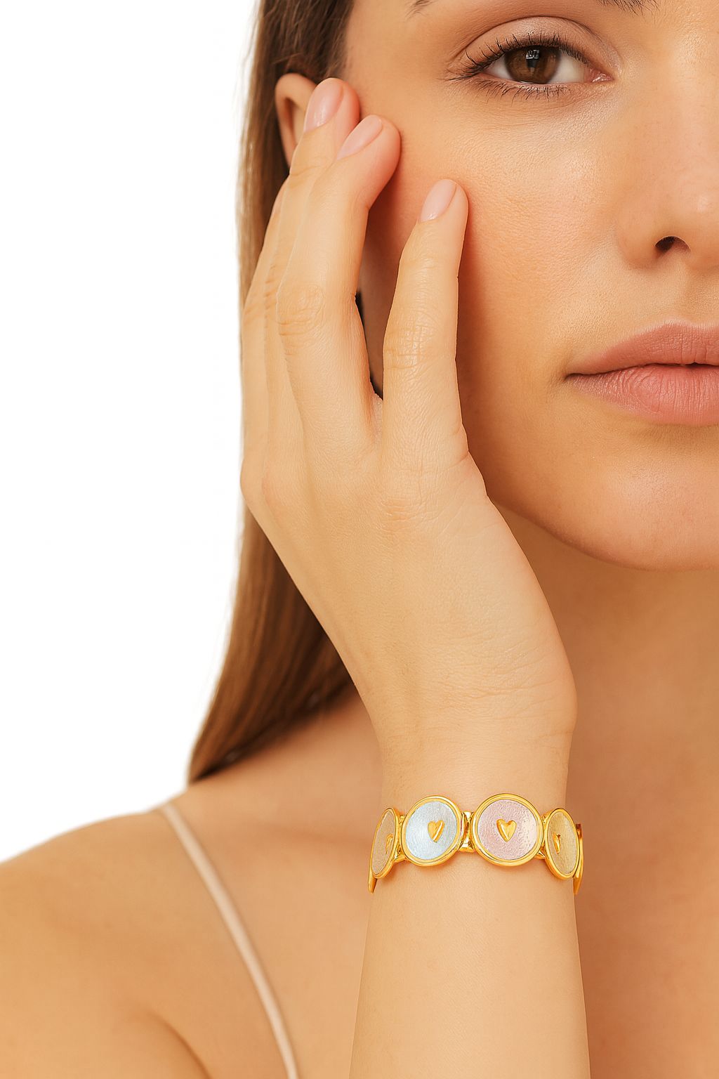 Model wearing colorful KC gold heart bracelet, women’s fashion jewelry