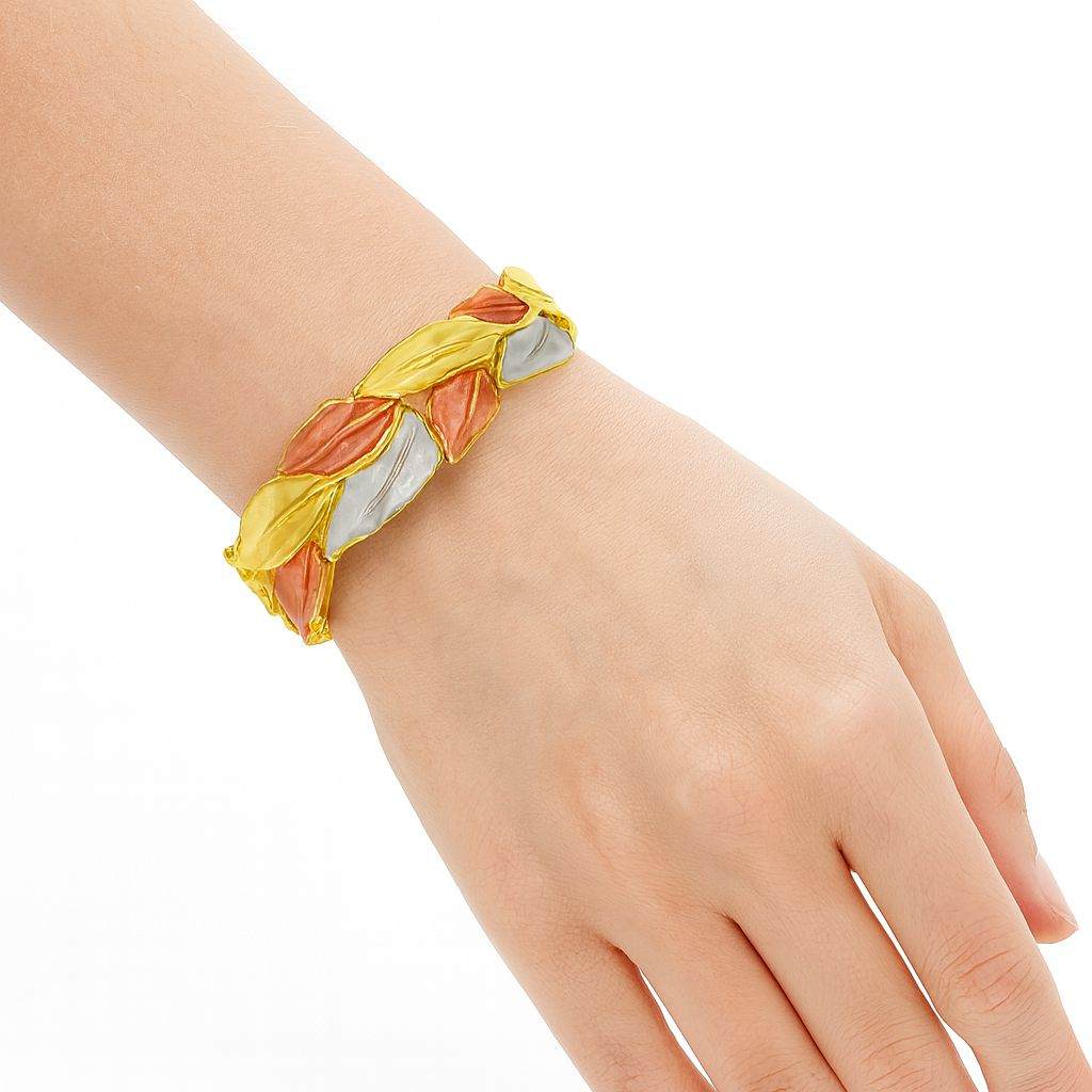 Woman wearing hand-painted gold leaf bracelet