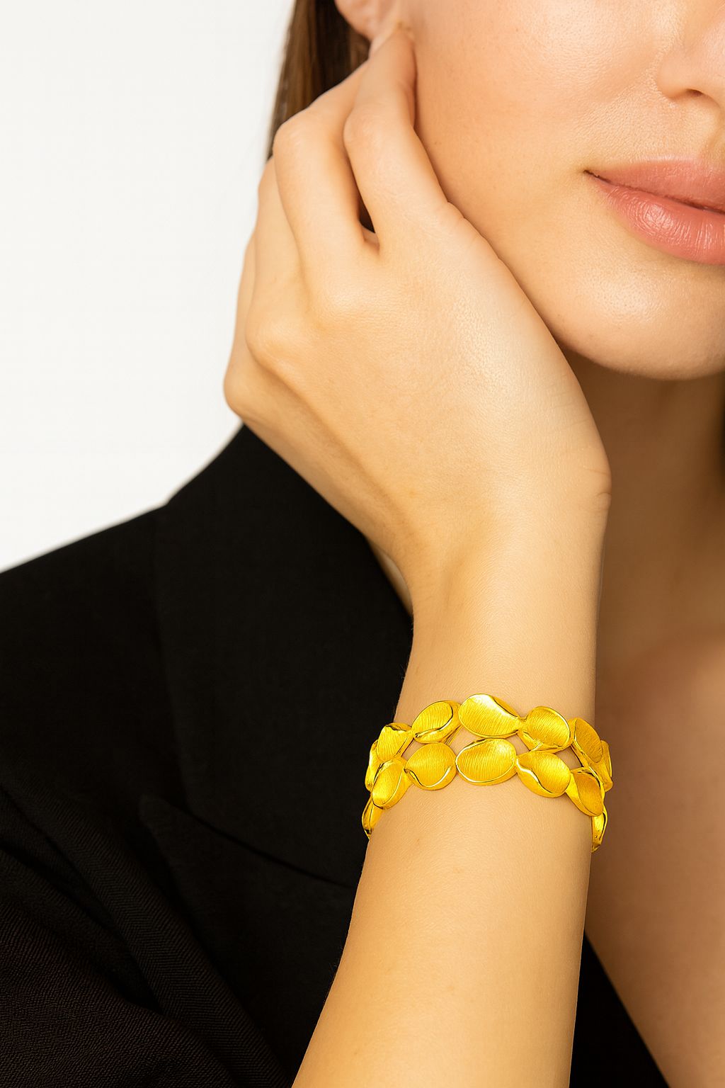 “Hand-painted KC gold floral bracelet showing petal detail”