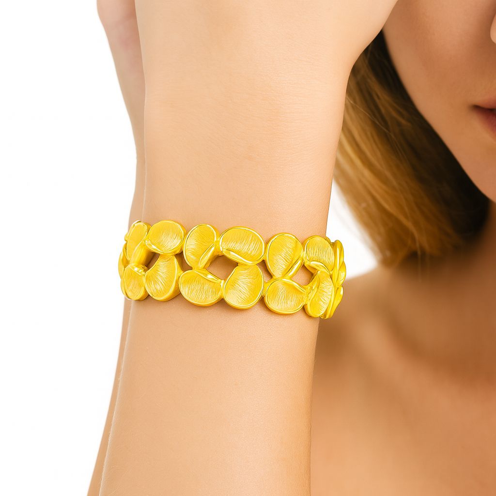 “Model wearing KC gold petal bracelet – elegant women’s jewelry”