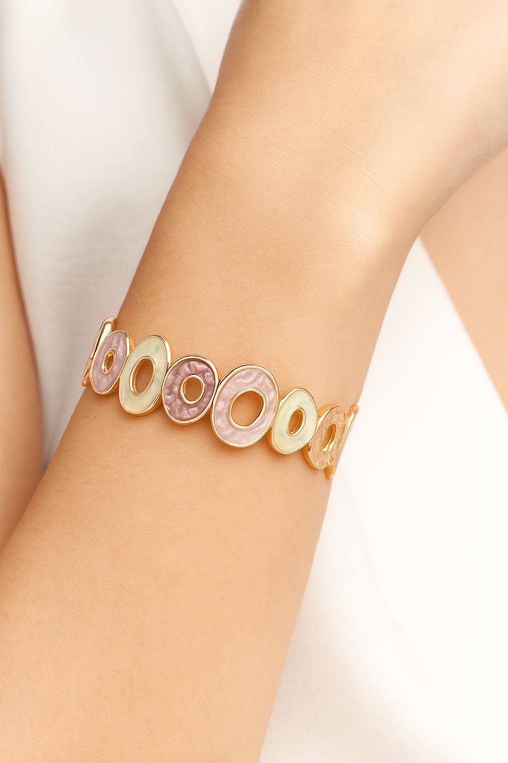 Model wearing blue and white hand-painted KC gold bracelet