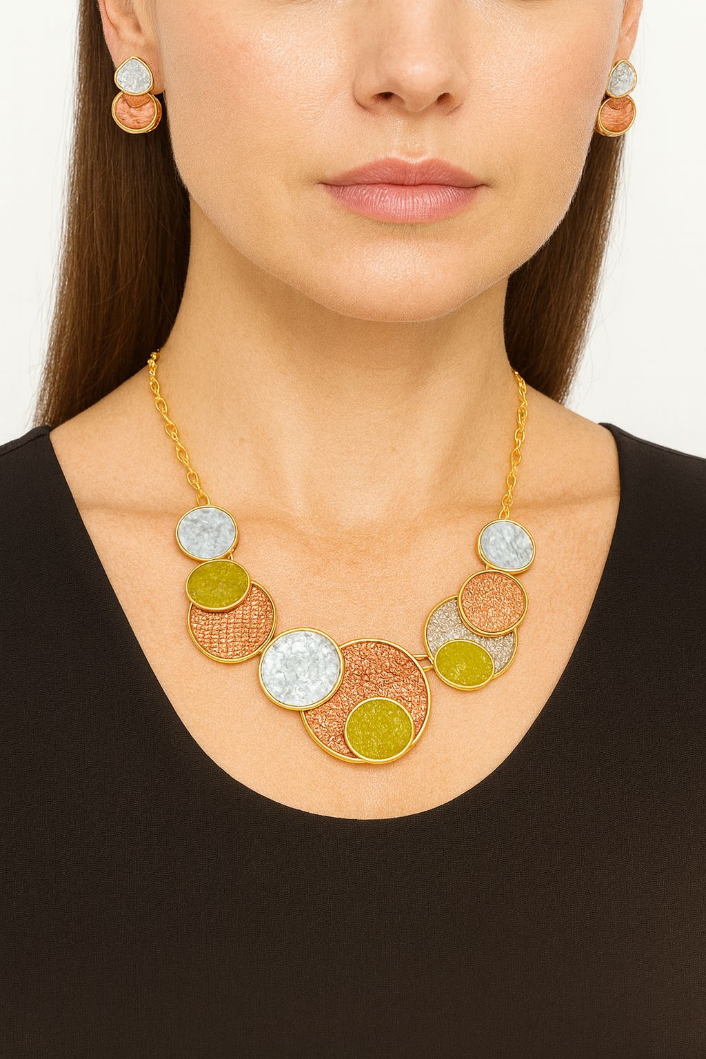 Close-up of KC gold plated enamel necklace with textured circular elements