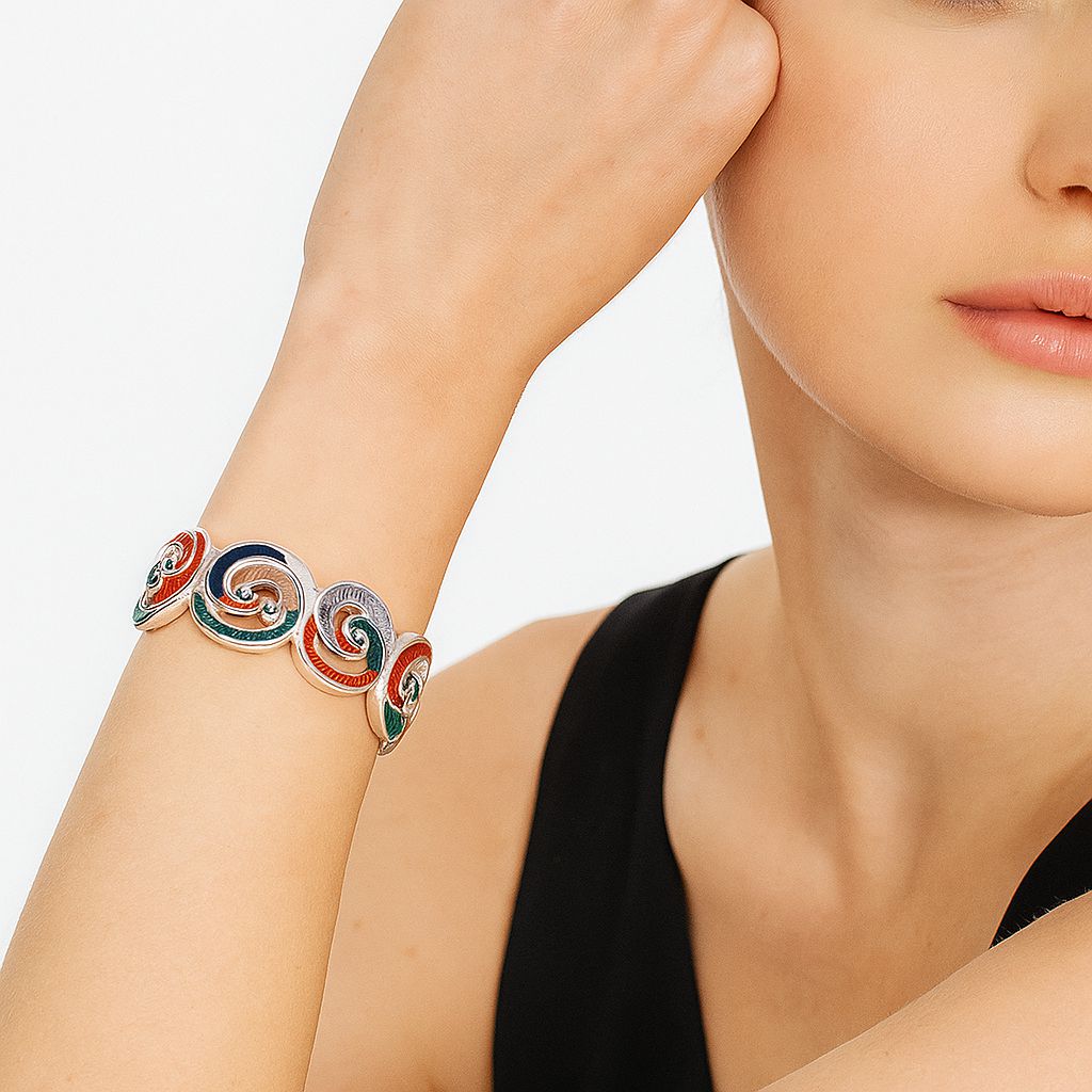 KC gold-plated alloy bracelet with artistic enamel swirls