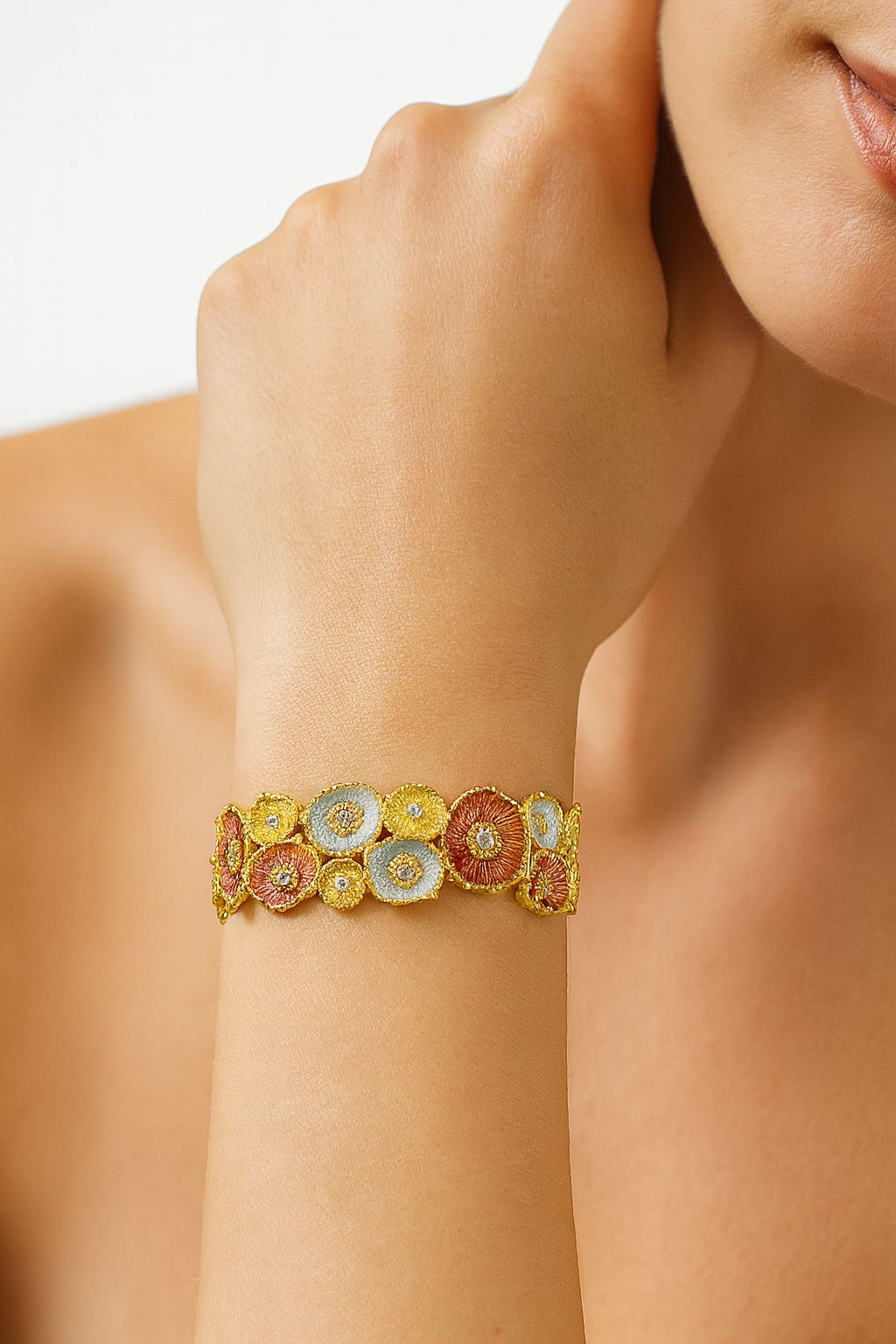 Floral enamel crystal bracelet with tri-color flowers and KC gold plating on wrist