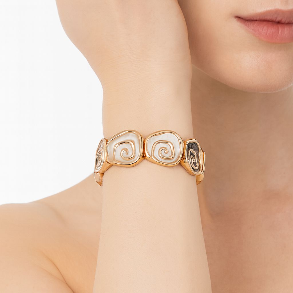 Close-up details of handmade enamel heart bracelet with gold alloy design