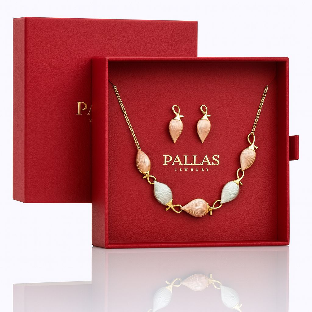 Model wearing gold plated leaf-design necklace and earrings