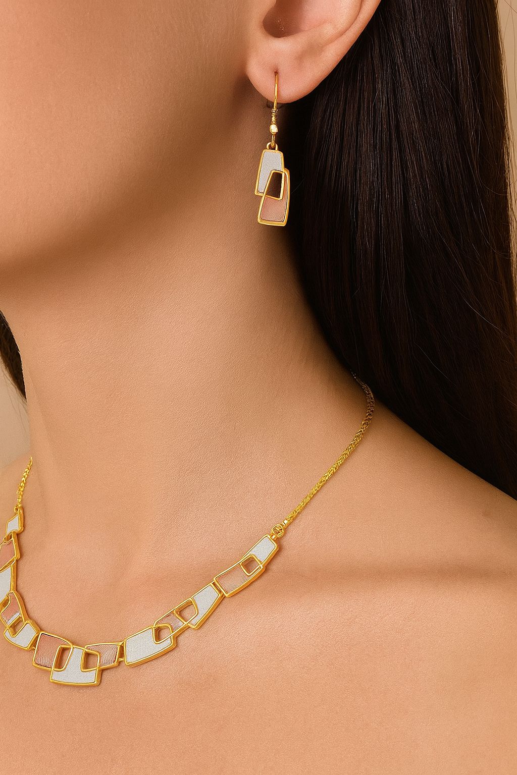 Model wearing geometric gold enamel necklace for women