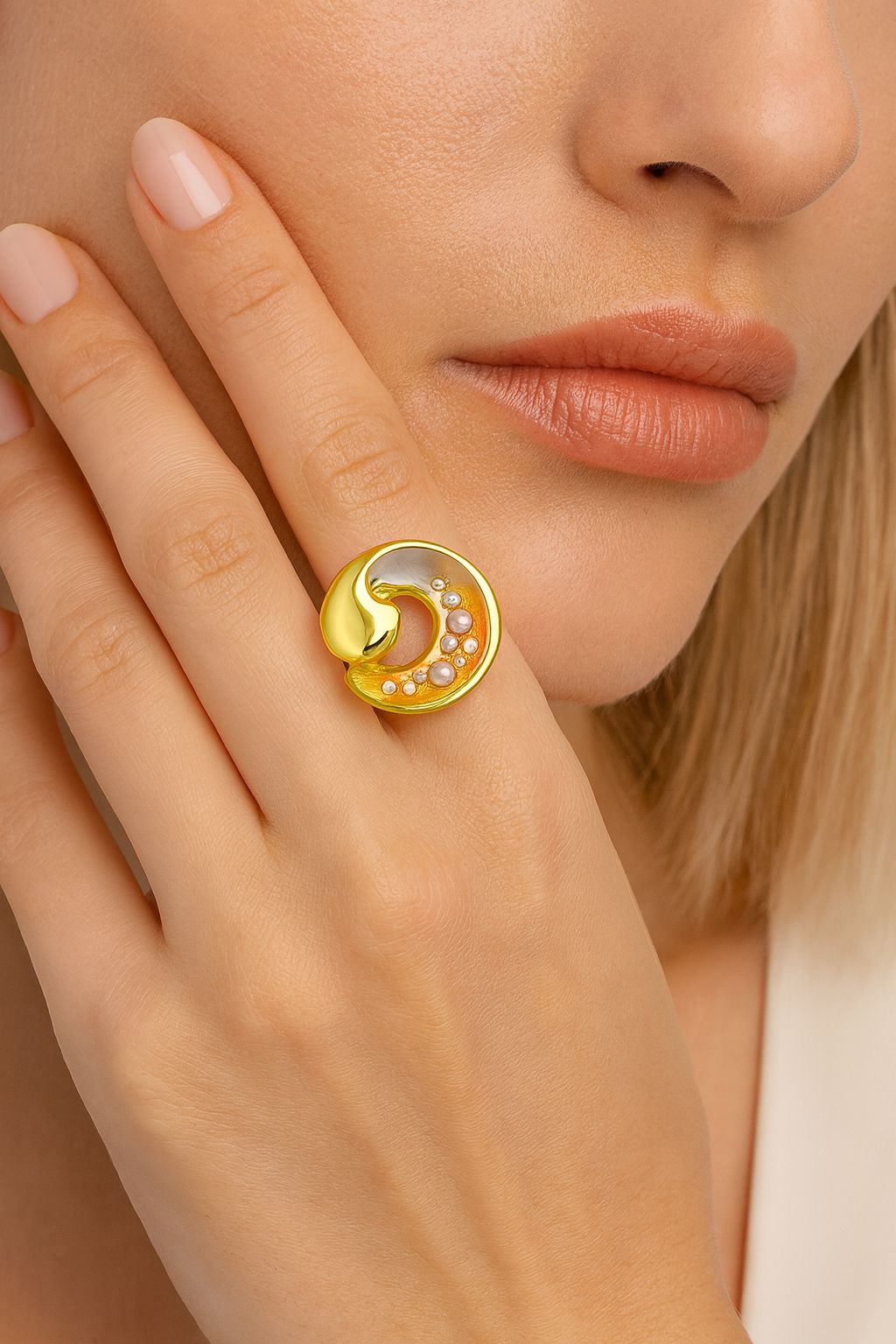 Close-up of hand-painted enamel wave ring with zircon stones