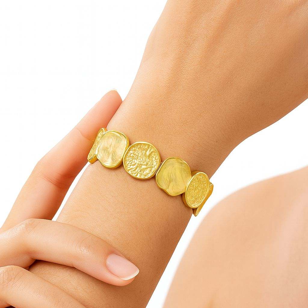 Vintage textured coin bracelet in KC gold plating on wrist, handcrafted alloy jewelry for women