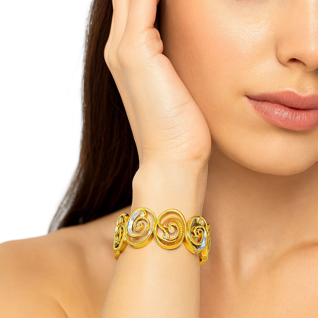 Women wearing KC gold enamel bracelet – lifestyle wrist image
