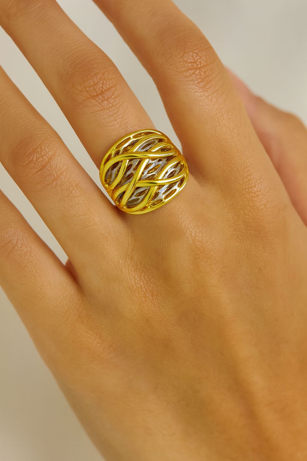 Fashion model showcasing chunky gold dome ring