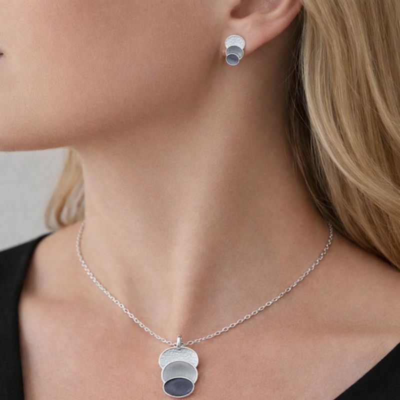 Layered circle enamel jewelry set worn by model