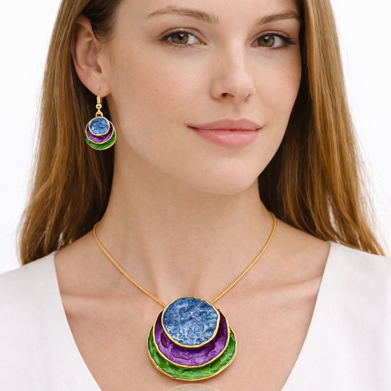 Layered disc enamel necklace and matching earrings worn on model with KC gold plating