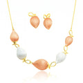 Gold leaf-bud necklace and earrings set with hand-painted finish