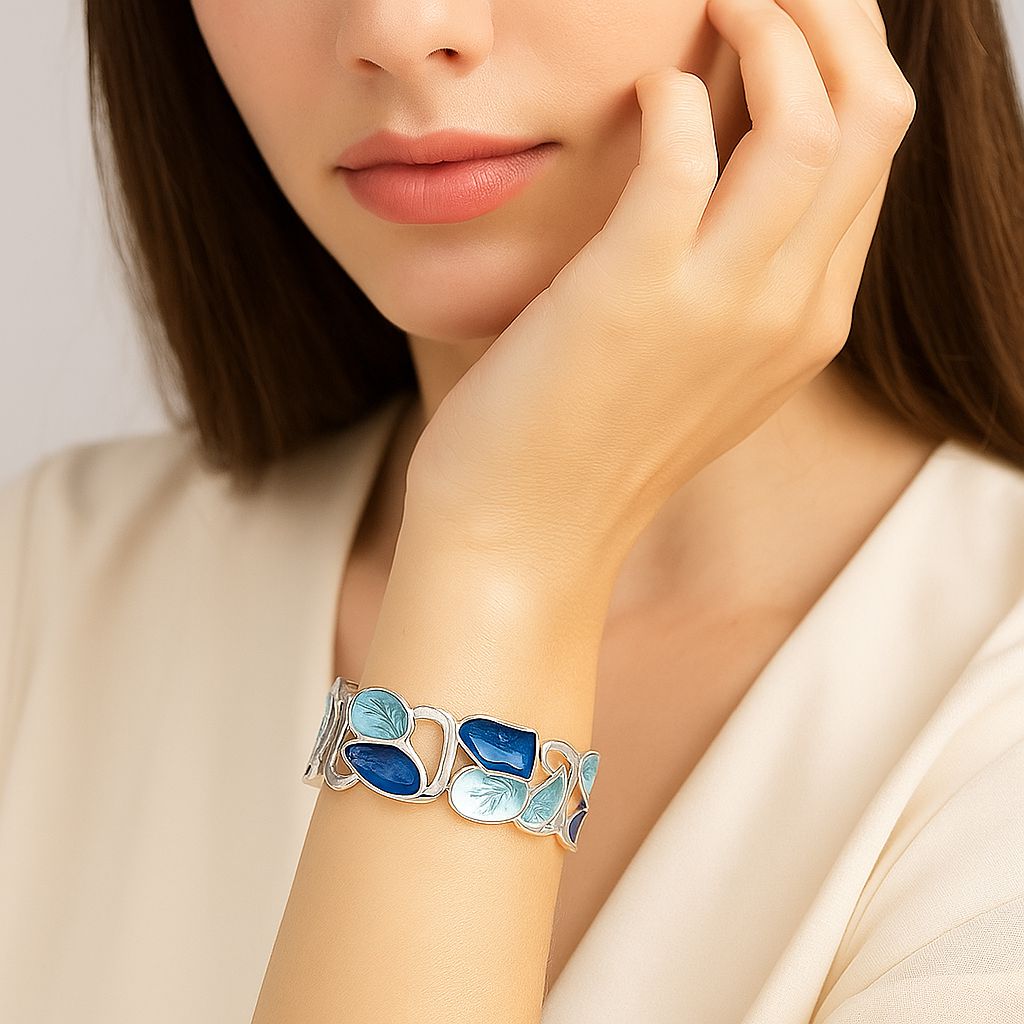 Artistic leaf enamel bangle worn on wrist