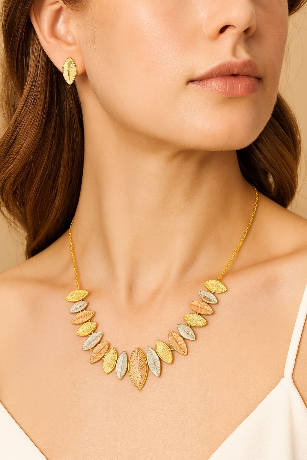 Close-up leaf necklace with KC gold plating and enamel finish