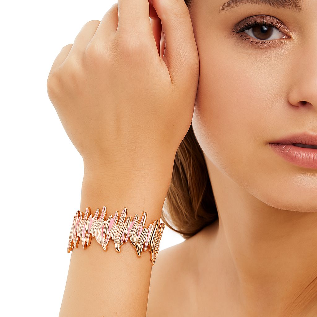 Model wearing gold drip necklace and matching earrings