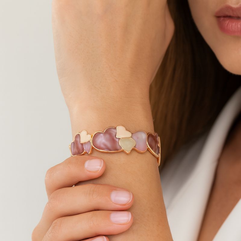 “KC gold plated bracelet with hand-painted enamel hearts”