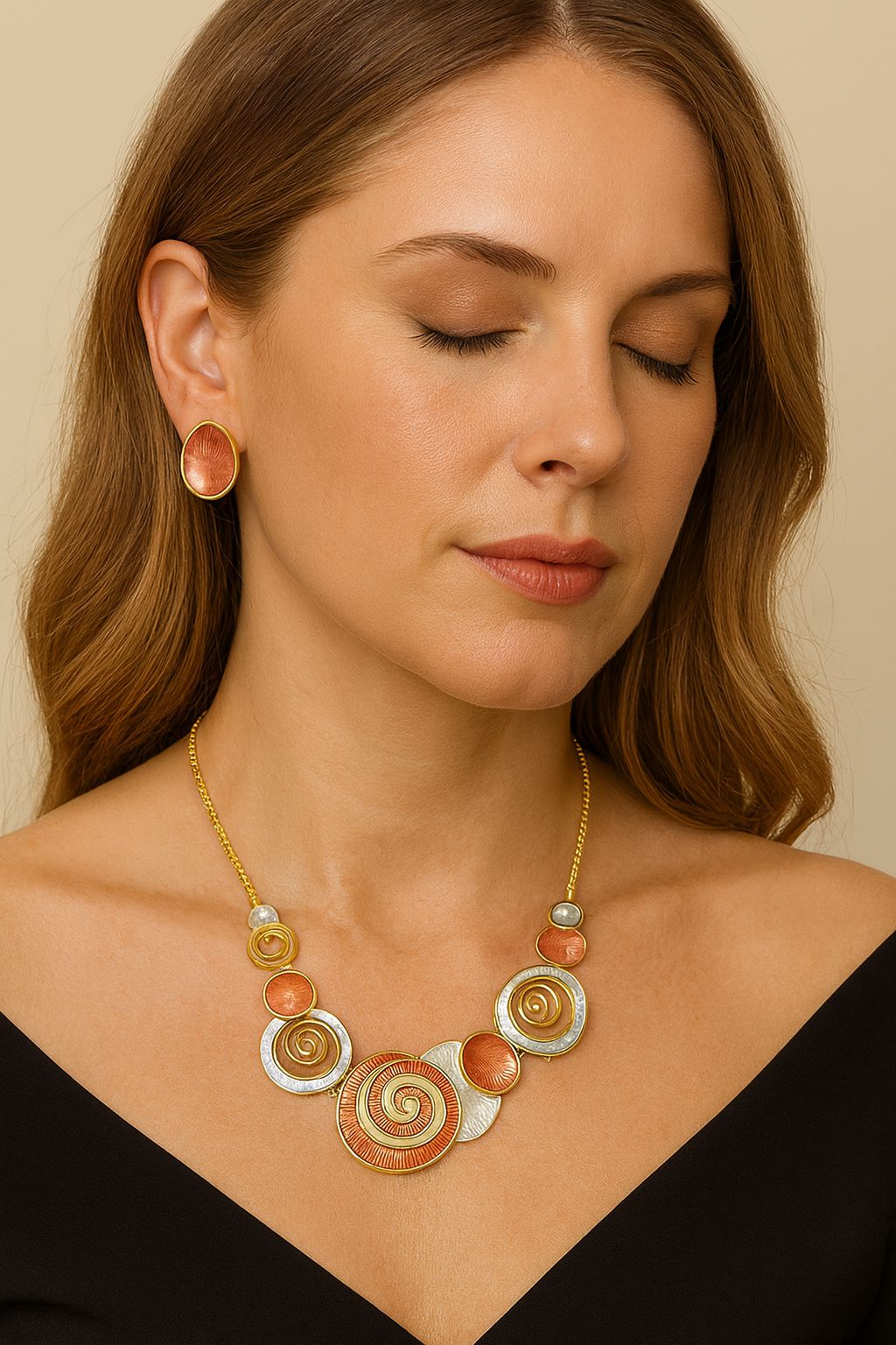 “Model wearing spiral artistic KC gold necklace and matching earrings”