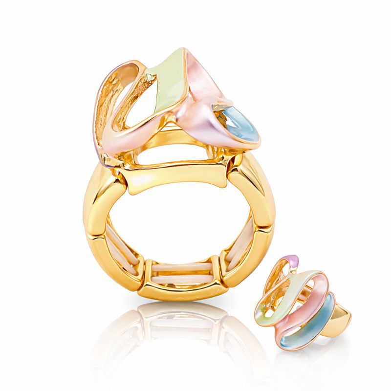 Modern statement gold ring with abstract enamel design on white background