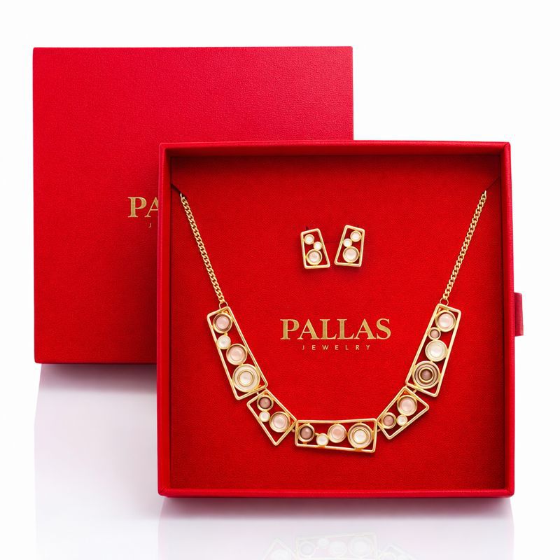 Modern geometric gold enamel jewelry set on white background