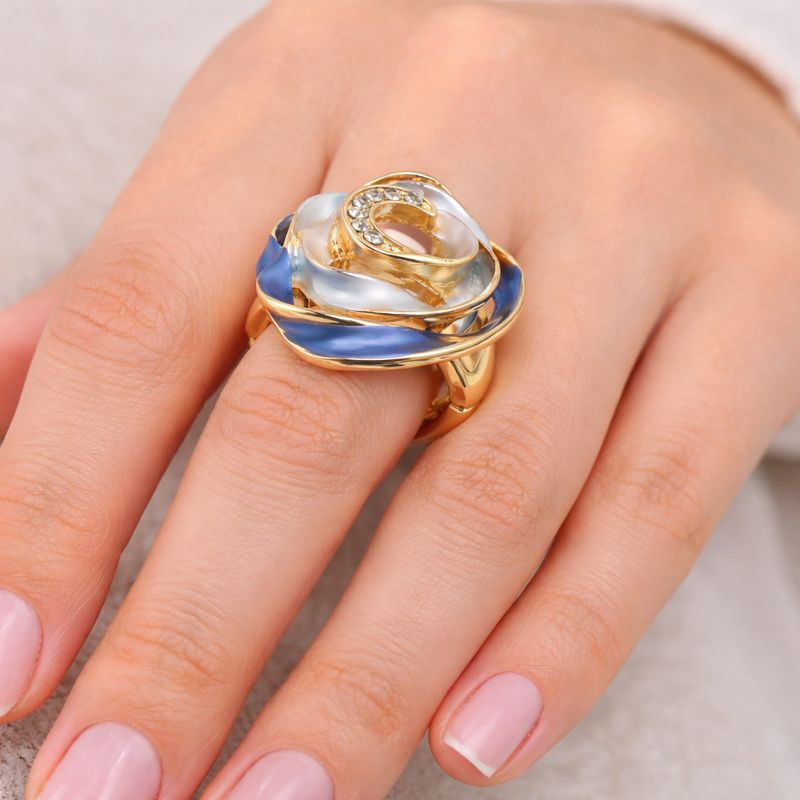 Modern swirl enamel statement ring worn on hand