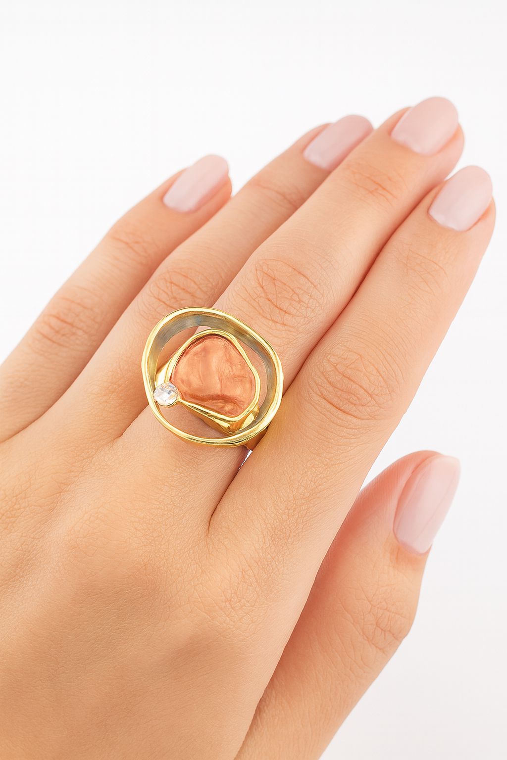 Modern KC gold plated fashion ring on model hand