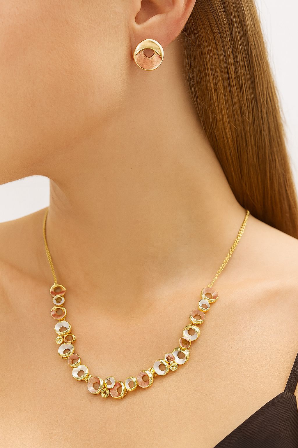 Women’s gold multi-tone circle jewelry set with necklace and matching earrings