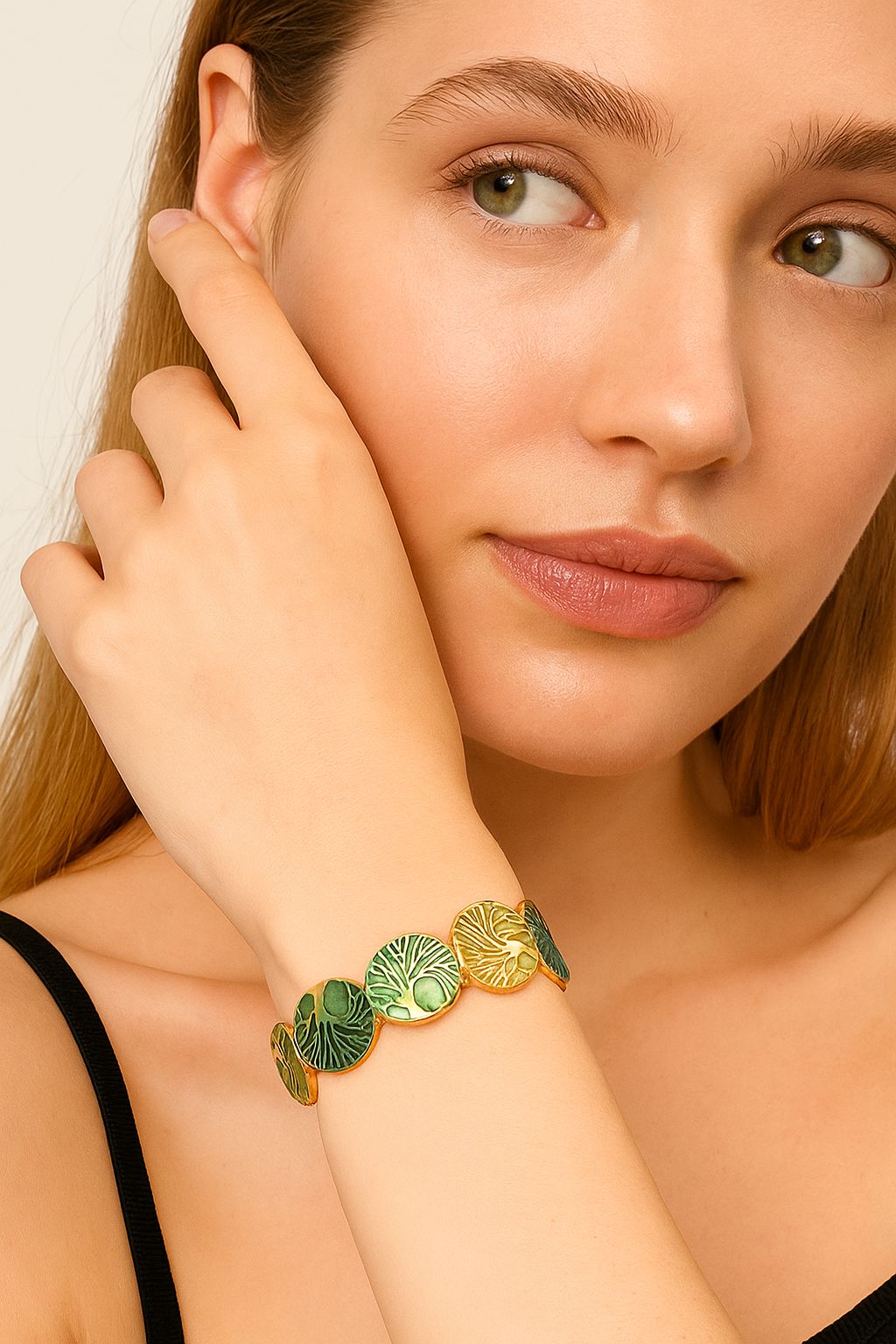 Model wearing green leaf enamel bangle bracelet