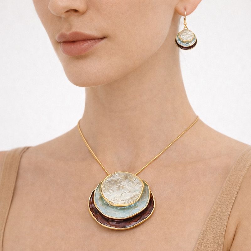 Elegant necklace and earring set highlighting the neckline when worn