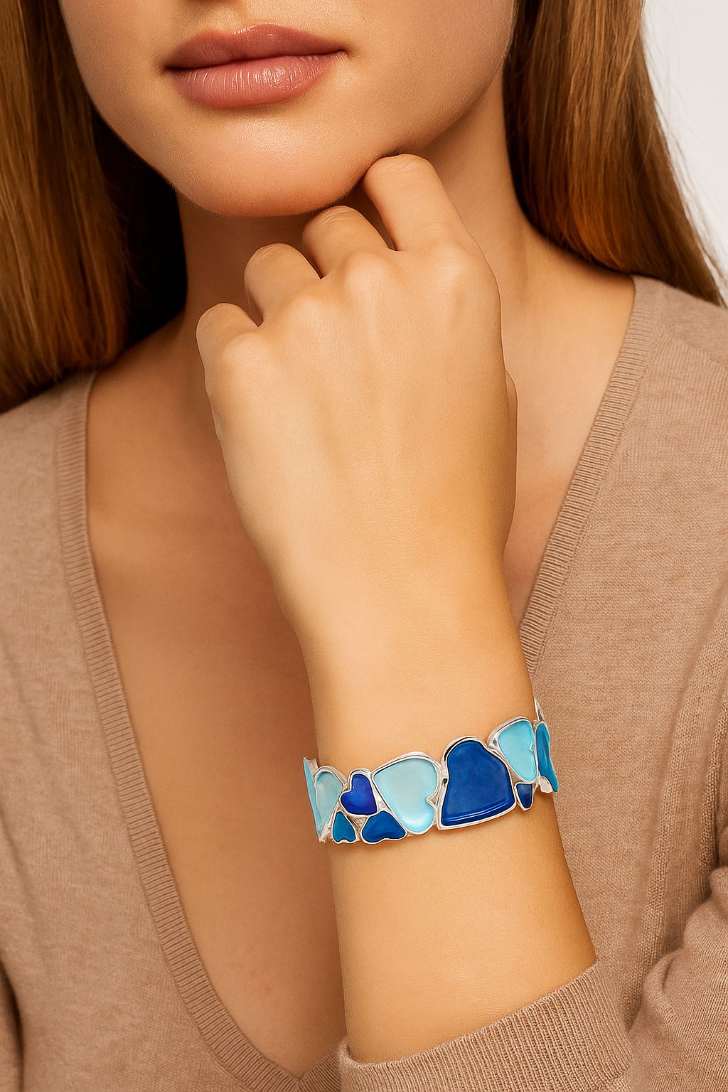 Women’s adjustable blue heart bracelet worn on wrist