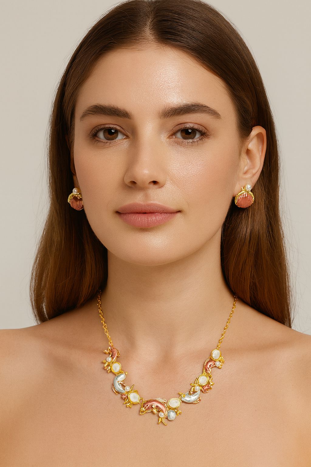Model wearing ocean dolphin and seashell necklace and earrings set, KC gold plated