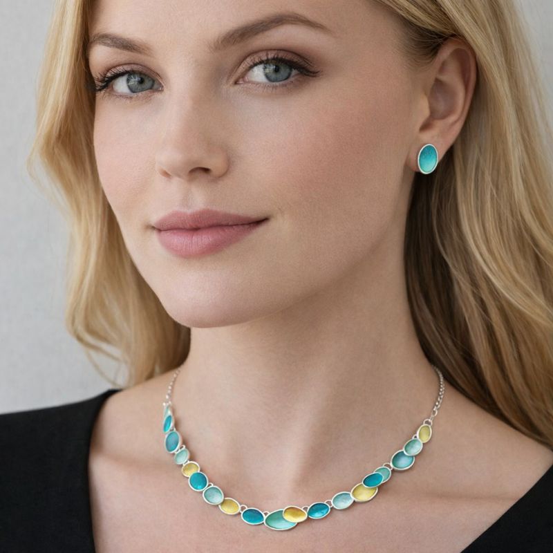 Oval enamel necklace with KC gold plated finish worn by model