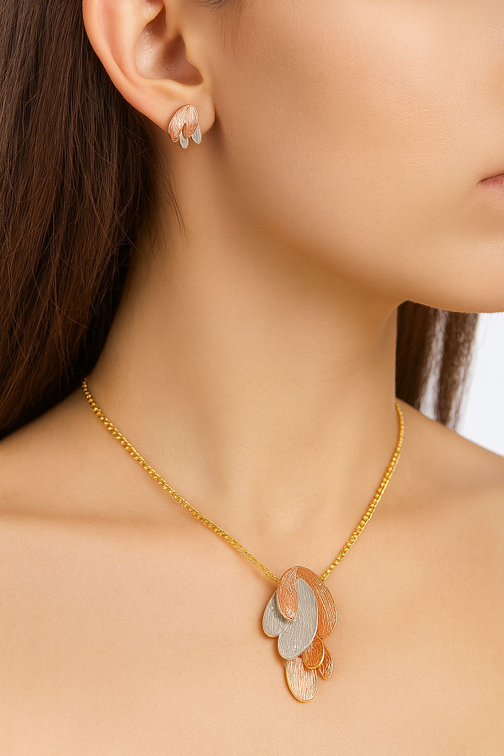 Close-up of layered oval pendant necklace with KC gold plating