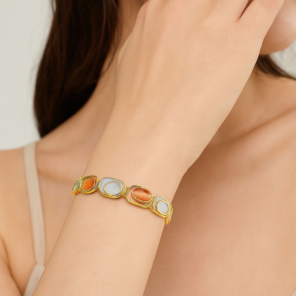 Model wearing hand-painted KC-gold bangle bracelet