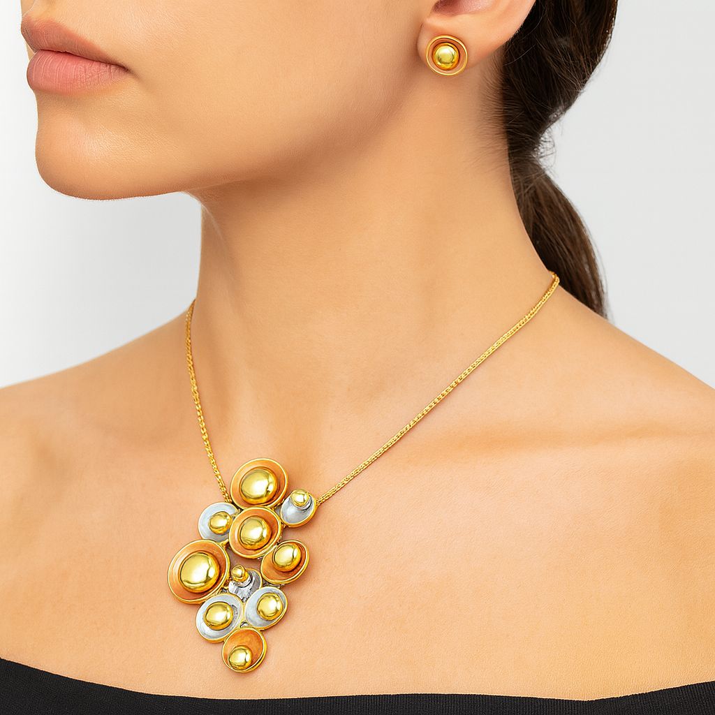 Model wearing handcrafted gold alloy necklace and earrings