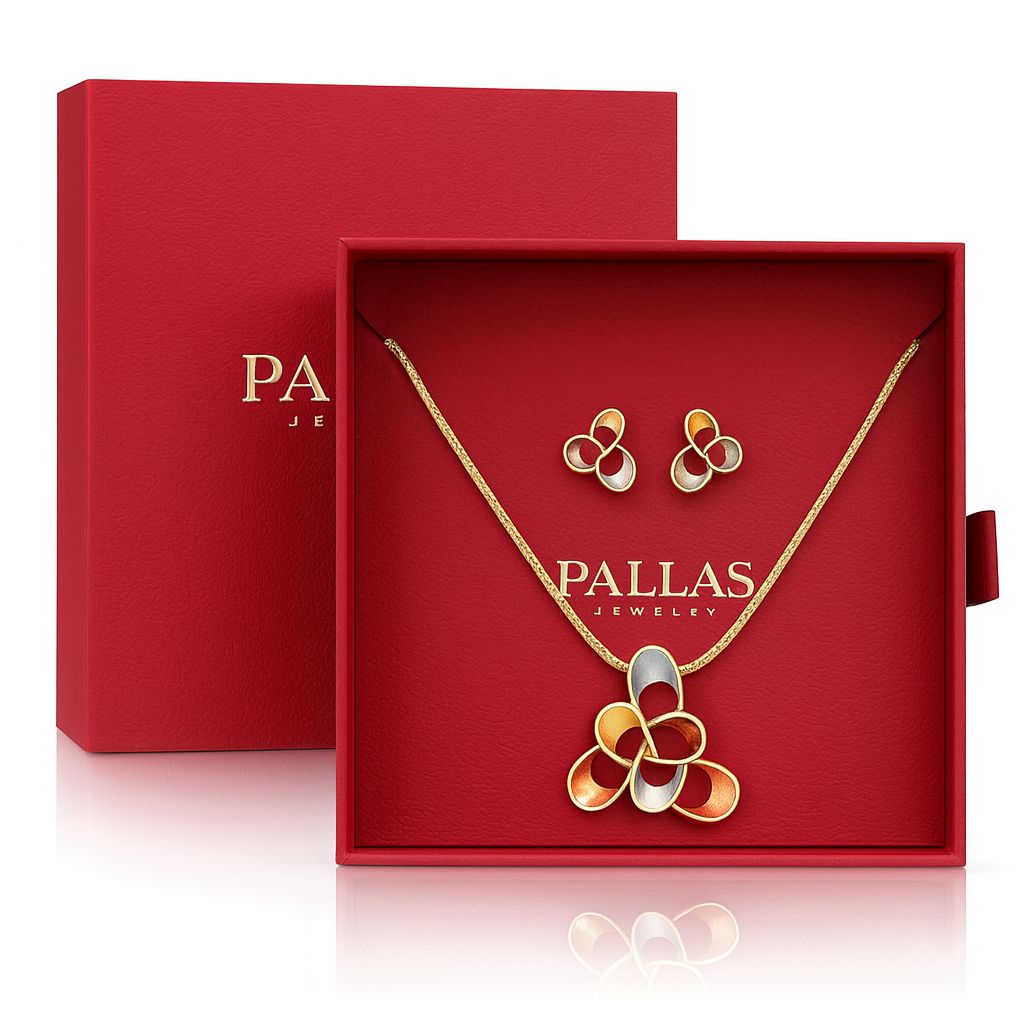Gold pendant necklace and stud earrings set with geometric tricolor design in red gift box