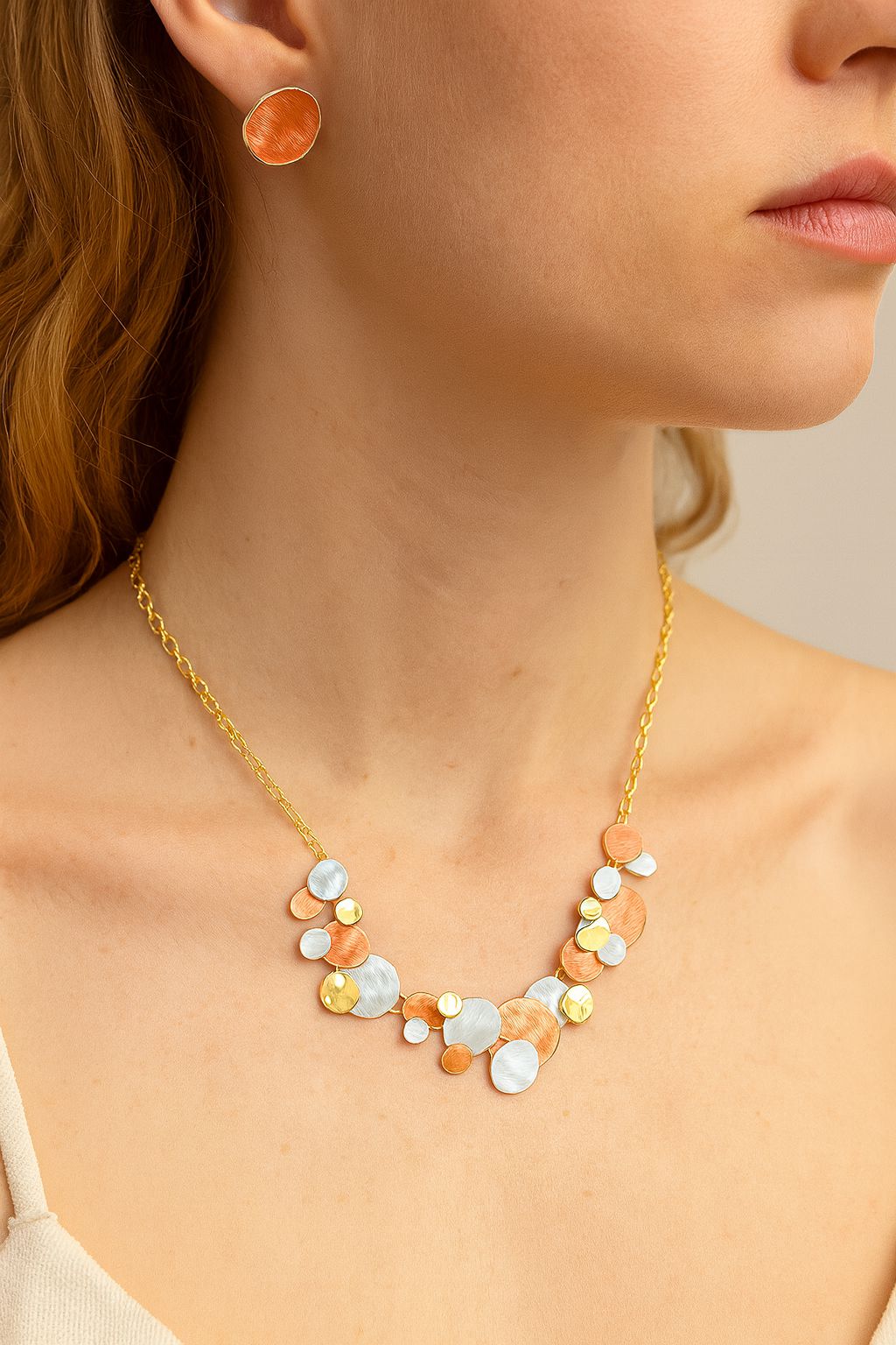 Close-up of textured hand-painted alloy necklace design