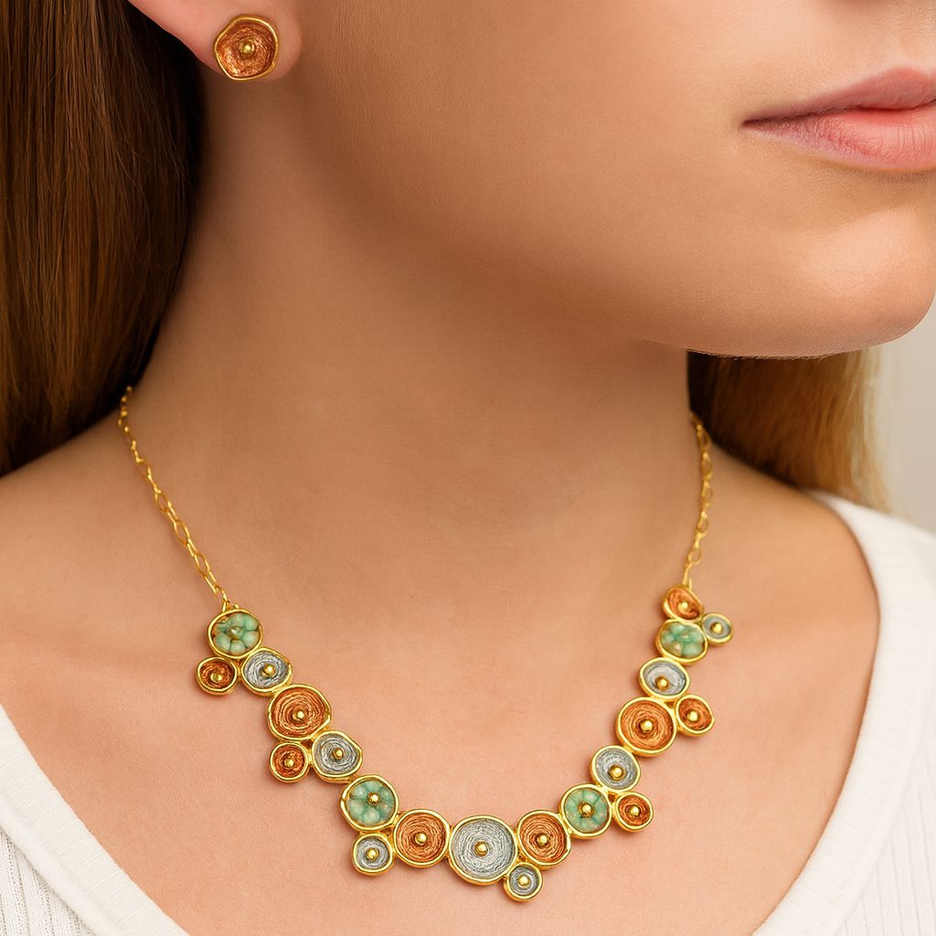 Close-up of hand-painted enamel circle necklace with KC gold plating