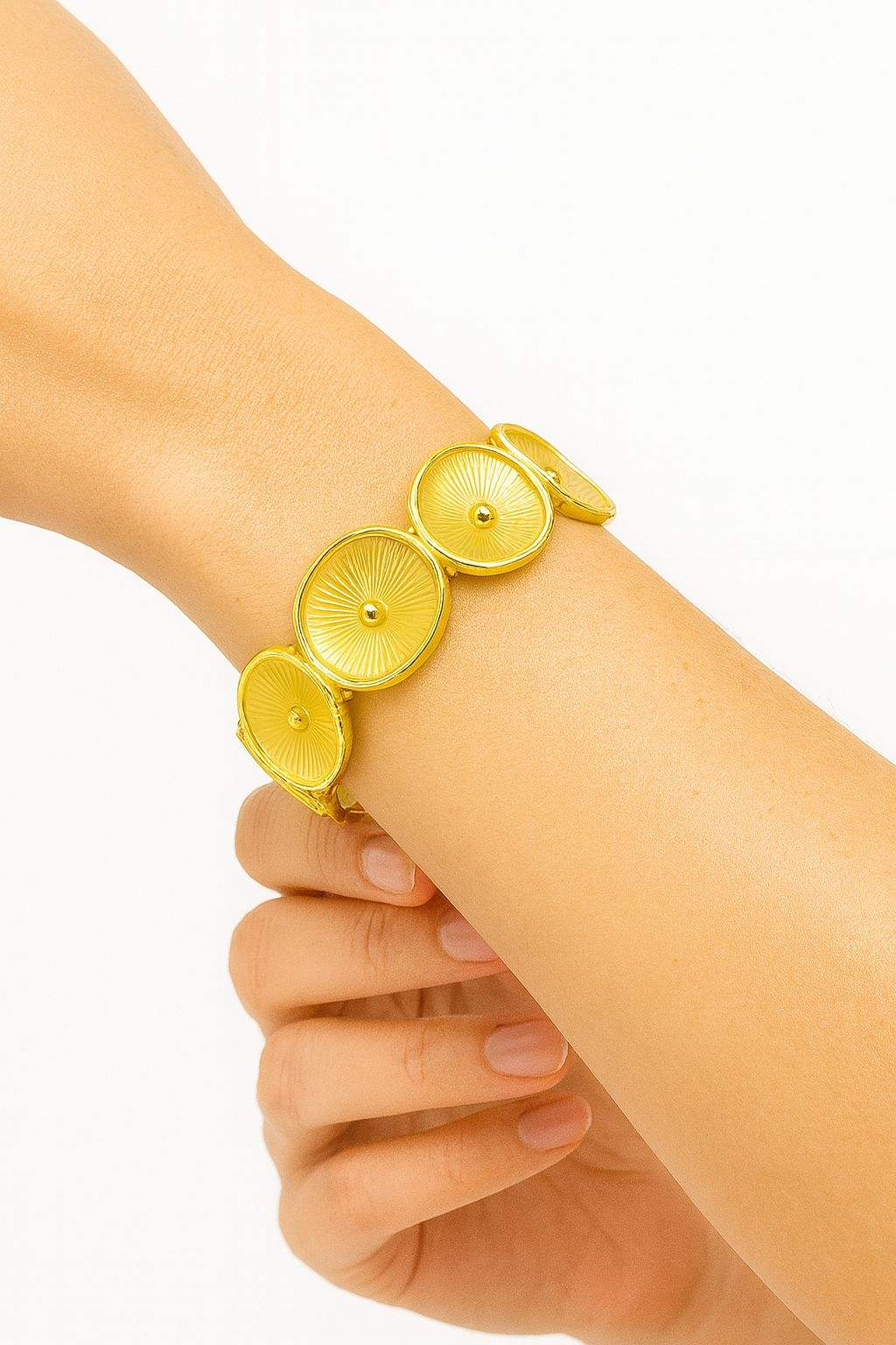 Sunburst KC gold plated bracelet with radiant textured discs on wrist by Pallas Jewellery