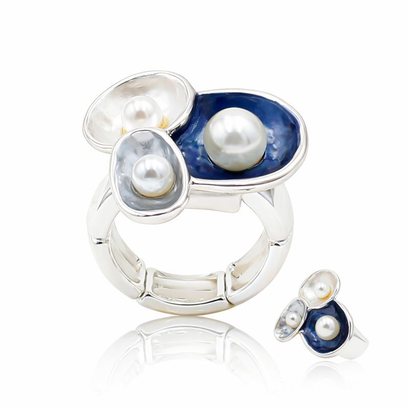 Pearl enamel silver ring worn on hand with modern organic design