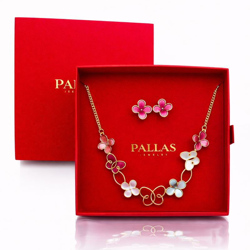 Romantic enamel necklace and earring set on white background