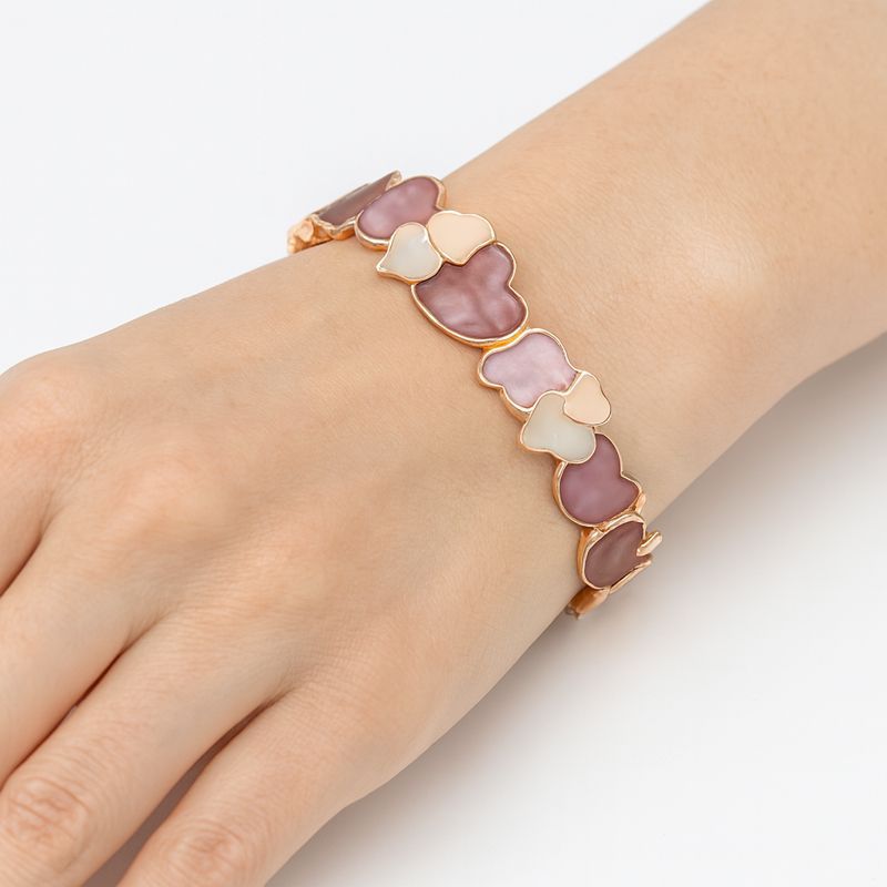 Women’s pastel heart bracelet featuring soft pink and ivory tones